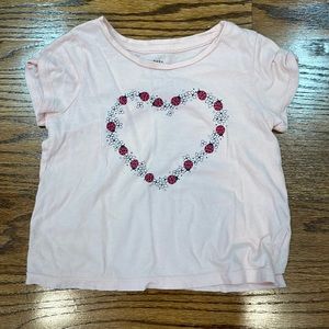Pale pink tee with ladybugs and flowers in shape of heart
